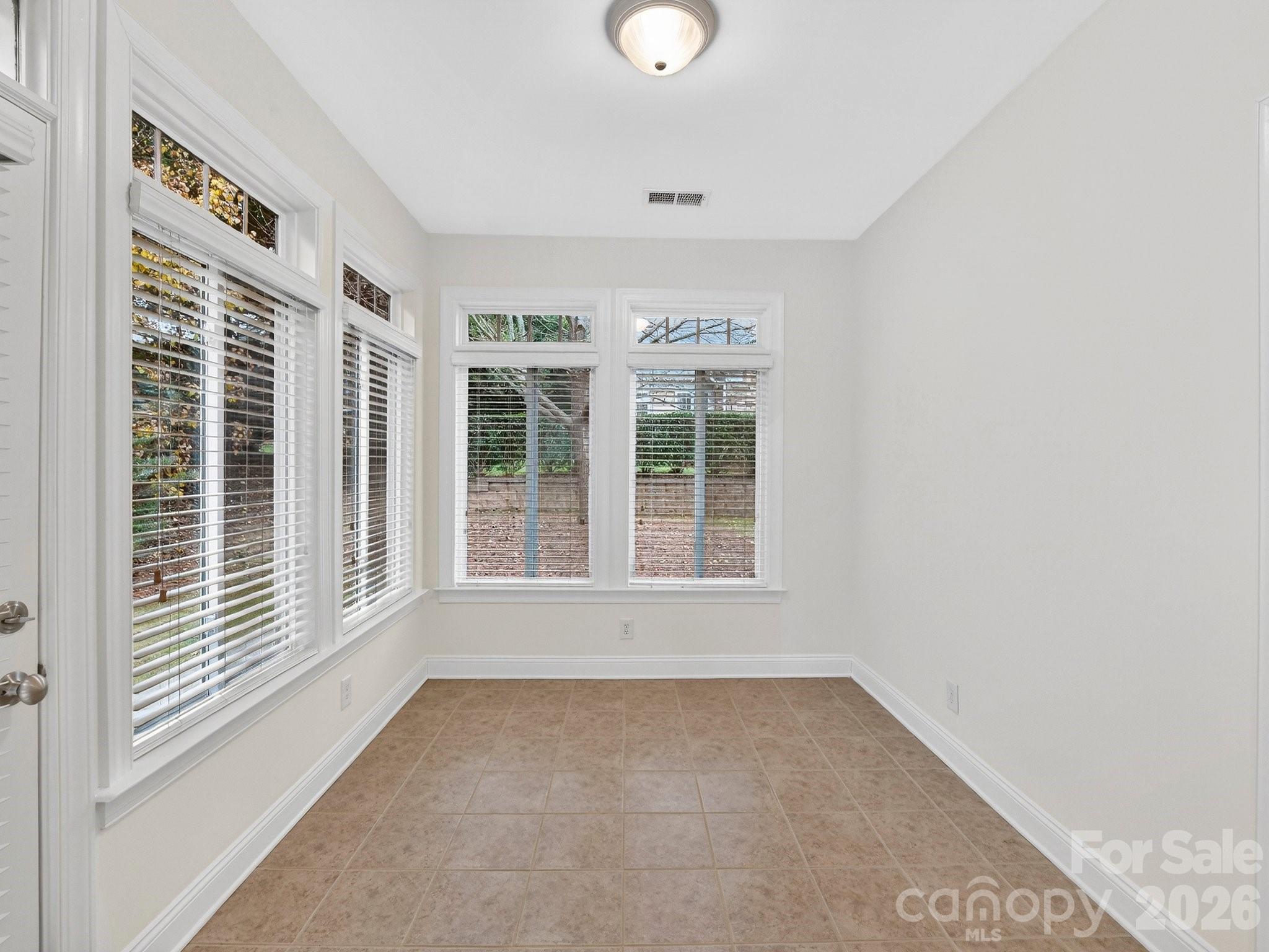 2963 Bellasera Way Matthews, NC 28105 - Photo 34 of 45 an empty room with windows