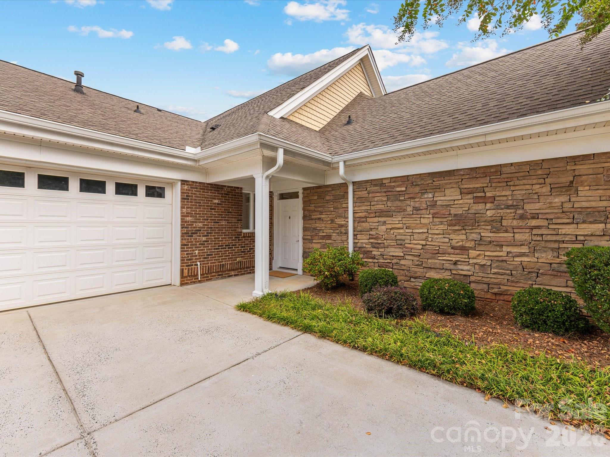 2963 Bellasera Way Matthews, NC 28105 - Photo 4 of 45 a view of a house with a yard and potted plants