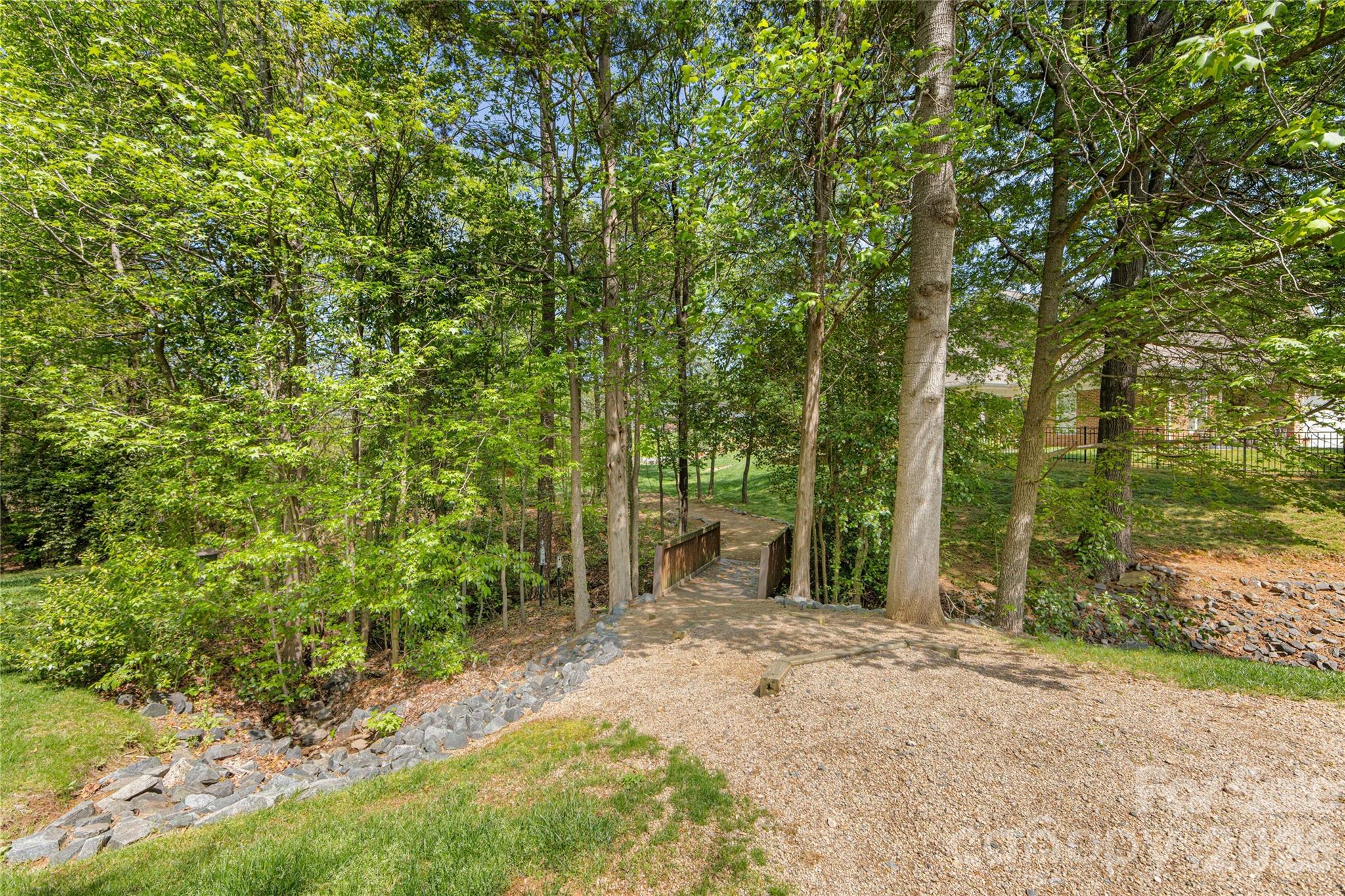 2963 Bellasera Way Matthews, NC 28105 - Photo 45 of 45 a view of a yard with plants and trees