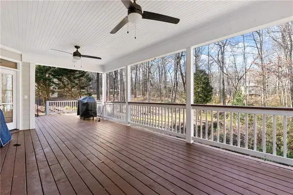a view of a porch with wooden floor and outdoor space