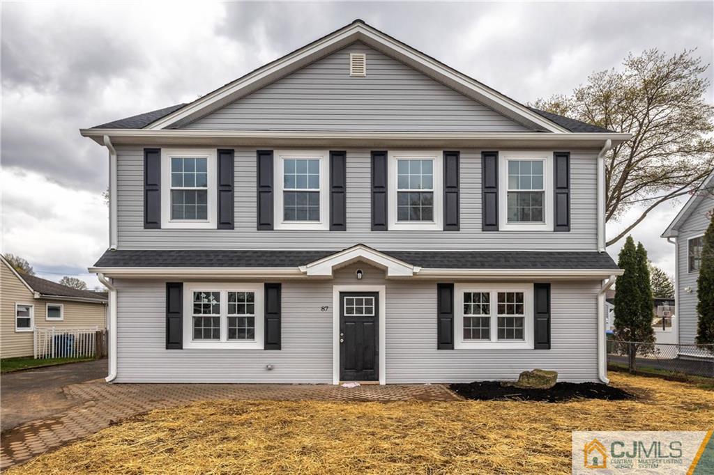 87 Ashley Road Edison, NJ 08817 - Photo 2 of 35 a front view of a house with a yard