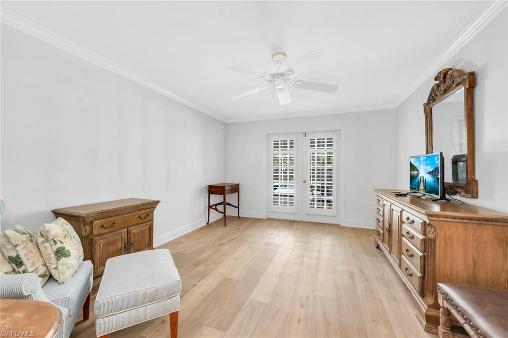 4711 Crayton Road Naples, FL 34103 - Photo 11 of 14 a view of a workspace with furniture and a window