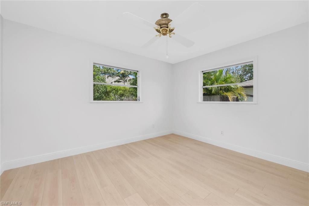 4711 Crayton Road Naples, FL 34103 - Photo 13 of 14 an empty room with windows
