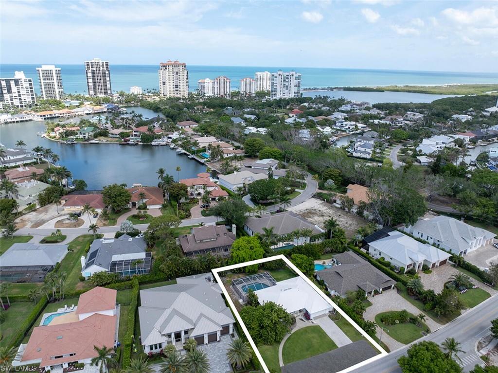 4711 Crayton Road Naples, FL 34103 - Photo 2 of 14 an aerial view of a city