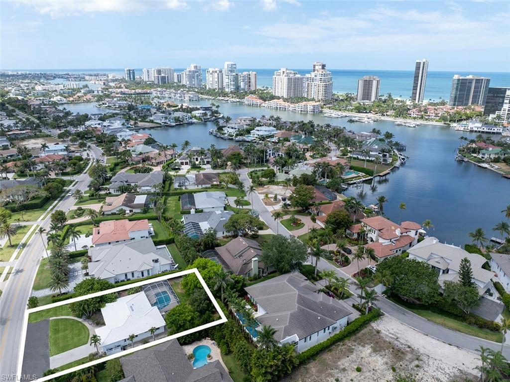 4711 Crayton Road Naples, FL 34103 - Photo 3 of 14 an aerial view of a city with lots of residential buildings