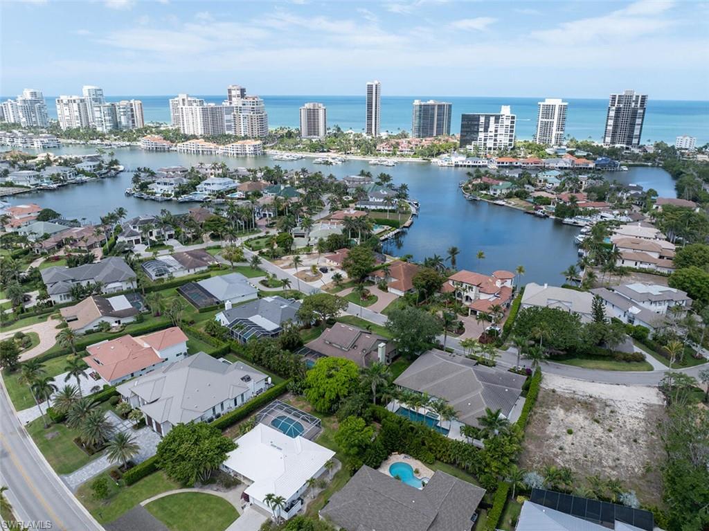 4711 Crayton Road Naples, FL 34103 - Photo 4 of 14 an aerial view of city and lake