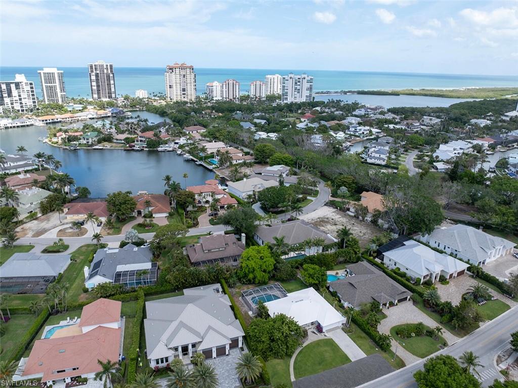 4711 Crayton Road Naples, FL 34103 - Photo 6 of 14 an aerial view of a city with lots of residential buildings