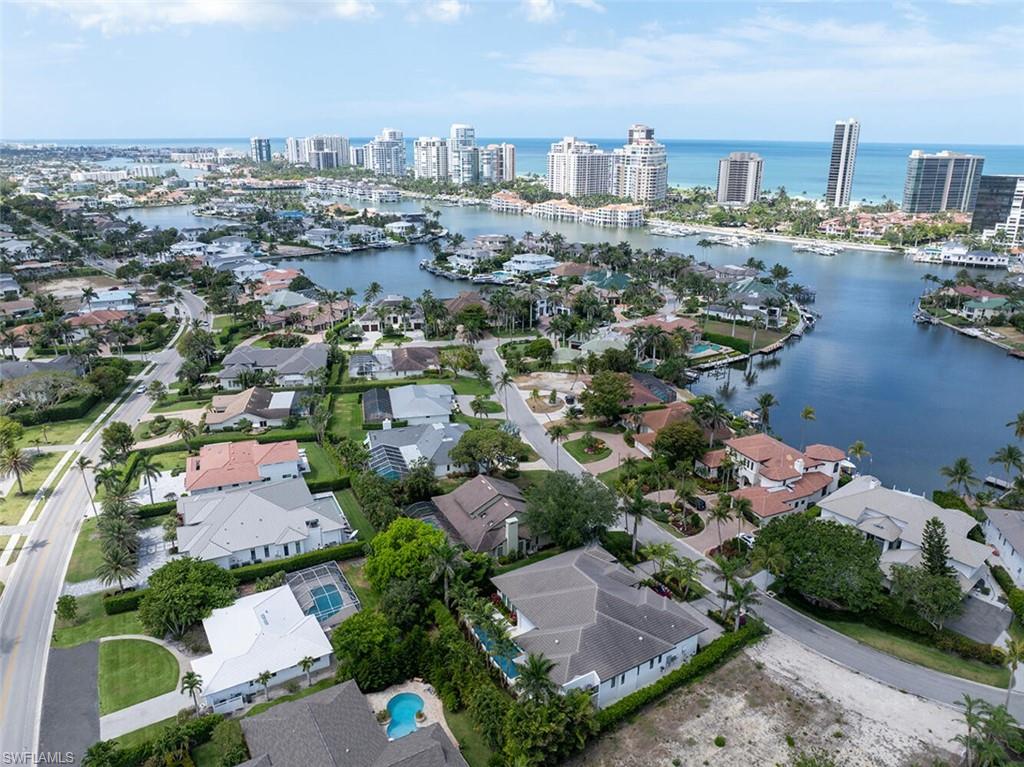 4711 Crayton Road Naples, FL 34103 - Photo 8 of 14 an aerial view of a city with lots of residential buildings
