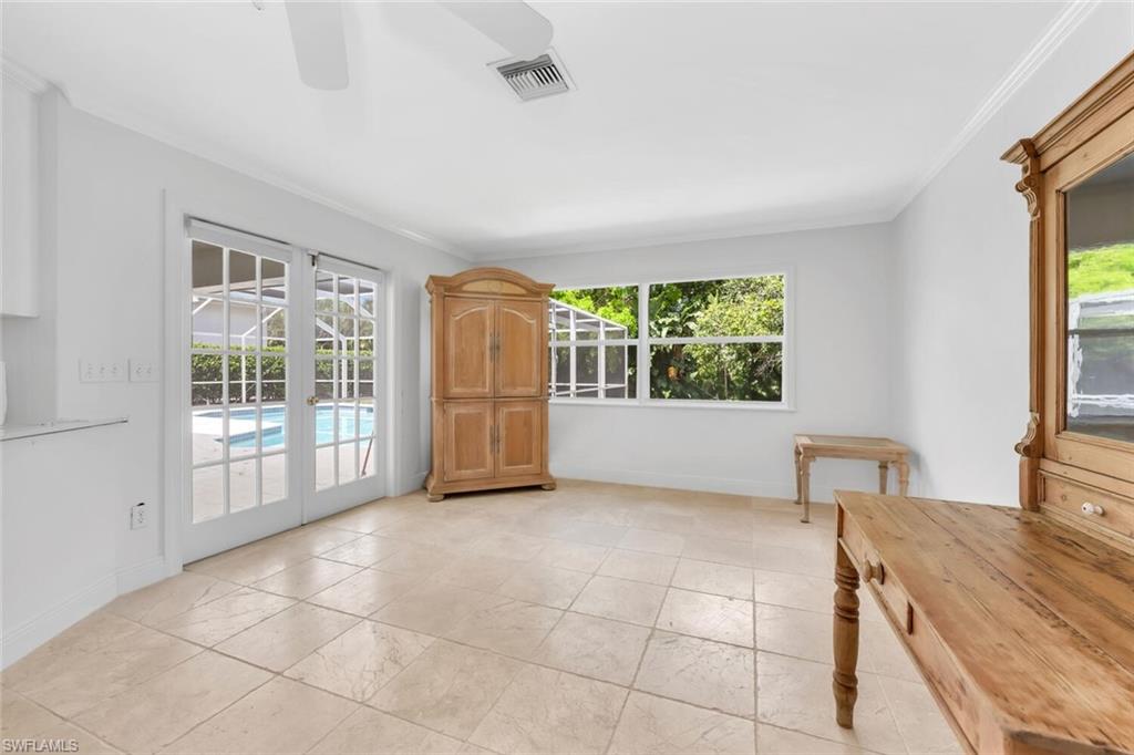 4711 Crayton Road Naples, FL 34103 - Photo 10 of 14 a view of an empty room with a window