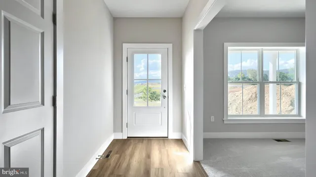 a view of an empty room and window