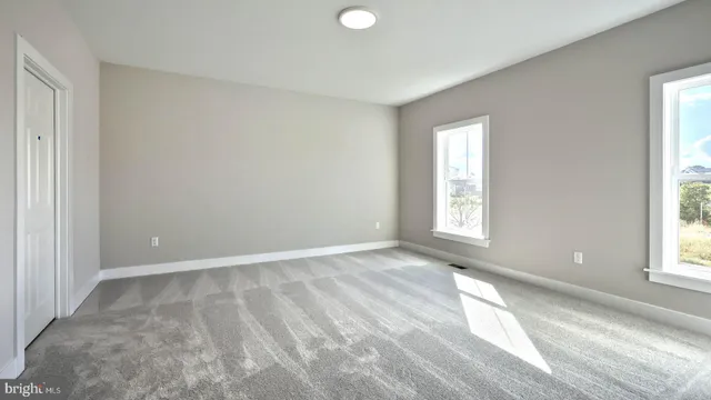 an empty room with windows