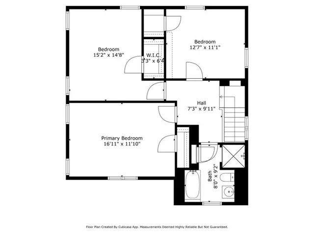 a picture of a bench in front of a wall