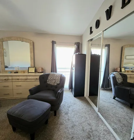 a living room with furniture and a rug