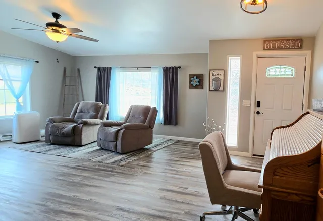 a living room with furniture and a window