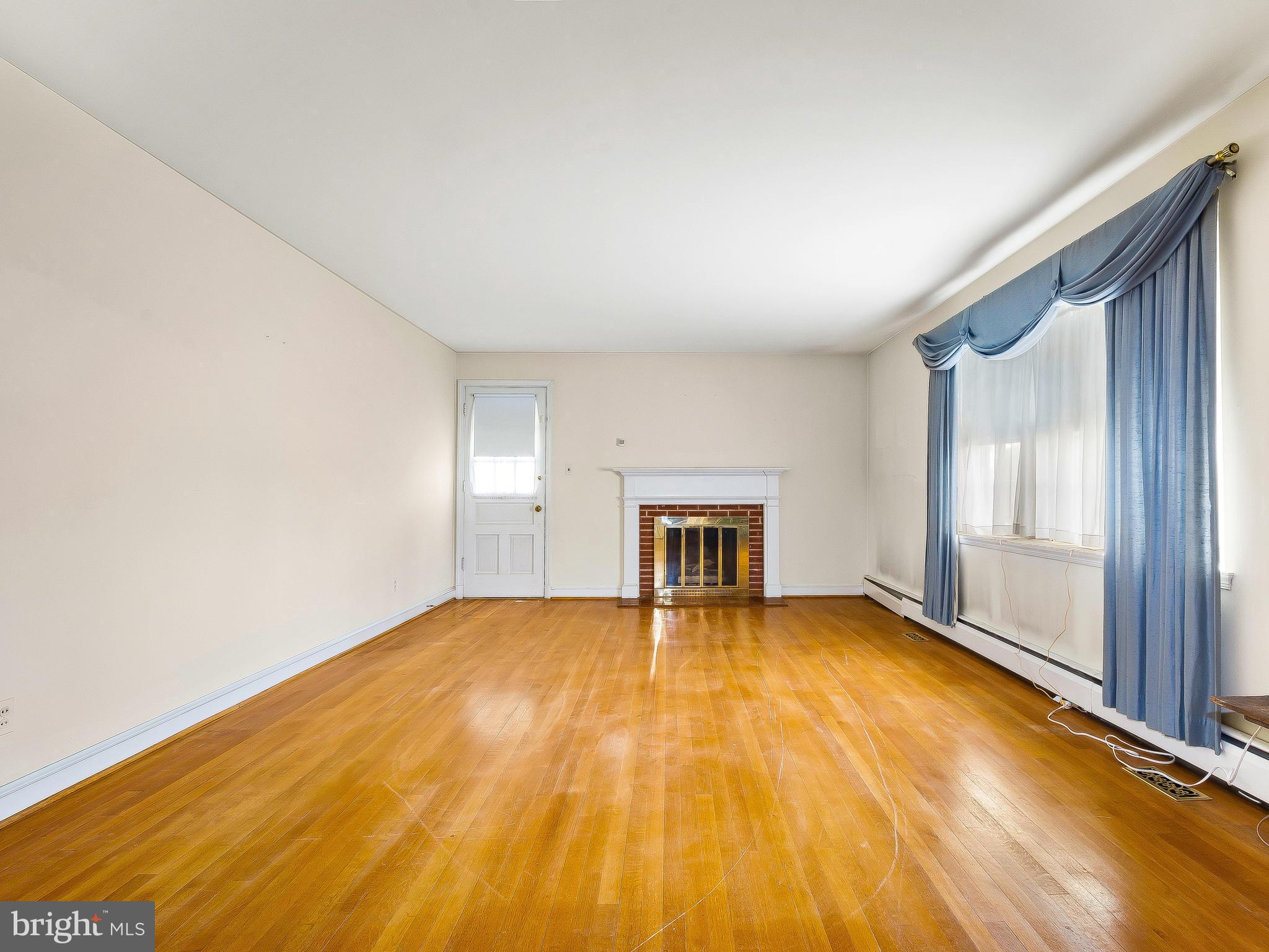 17305 Batchellors Forest Road Olney, MD 20832 - Photo 5 of 30 Bright & Sunny Living Room with fireplace