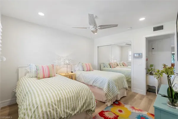 a bathroom with a sink toilet vanity and shower