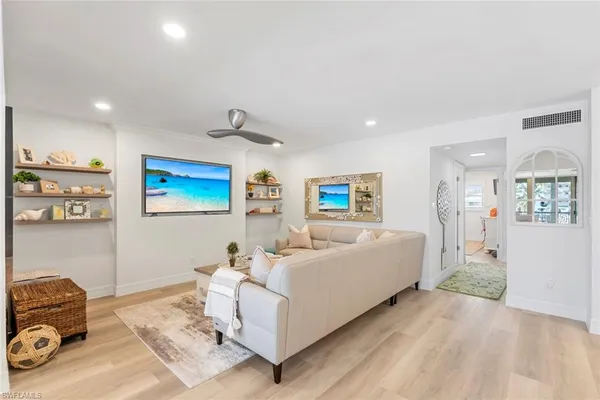 a living room with furniture and a table