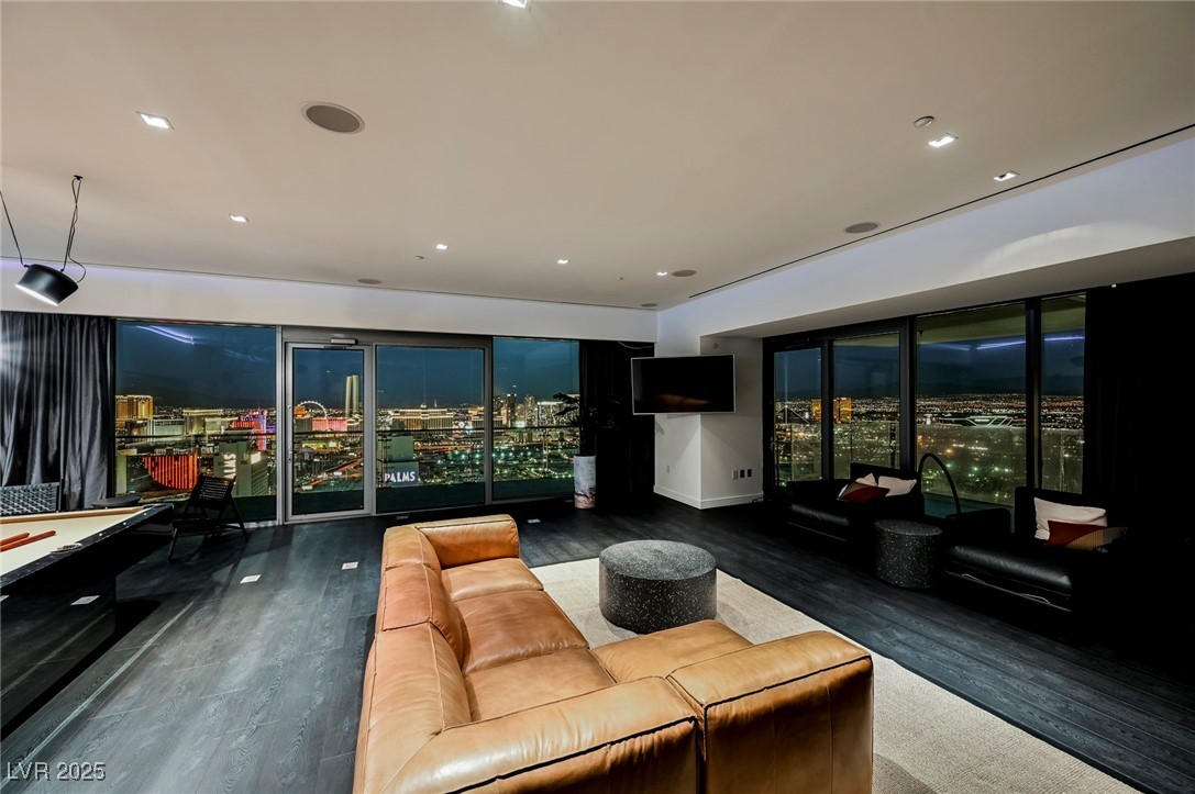 Living area with recessed lighting and full view of the Las Vegas Strip