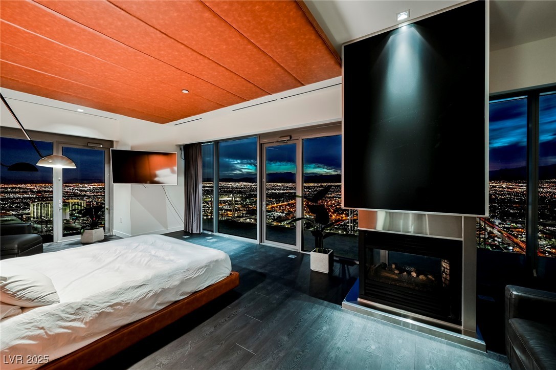 4381 West Flamingo Road, Unit 5708 Las Vegas, NV 89103 - Photo 5 of 34 Bedroom with multi sided fireplace