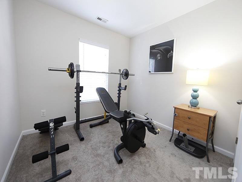 8210 Clasara Circle Raleigh, NC 27613 - Photo 12 of 14 a room with gym equipment and a window