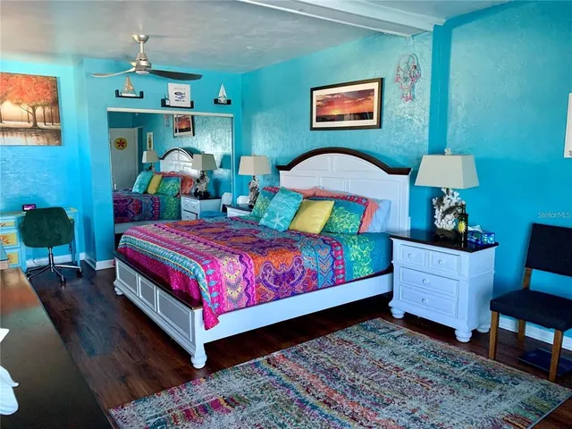 a bedroom with a bed and a dresser