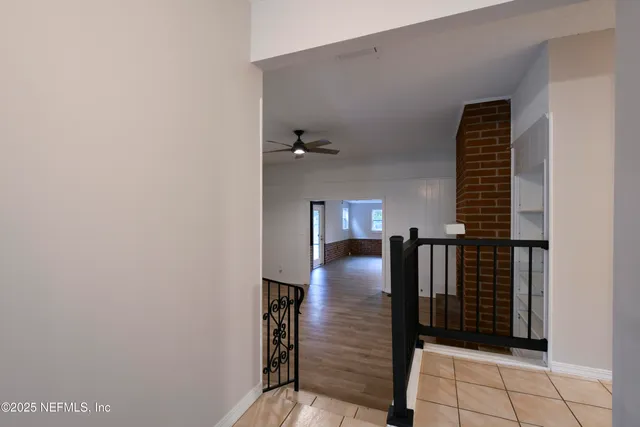 a view of entryway and hall with a window