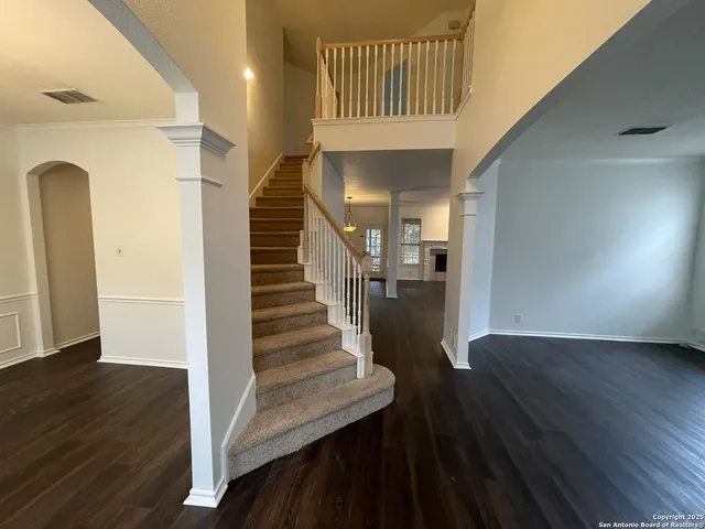 a view of entryway with wooden floor