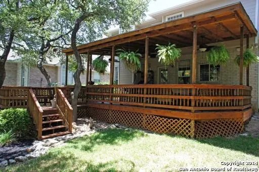 a view of a deck with a table and chairs