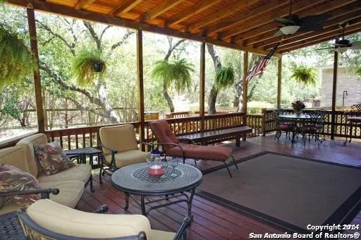 a outdoor dining space with furniture and outdoor view