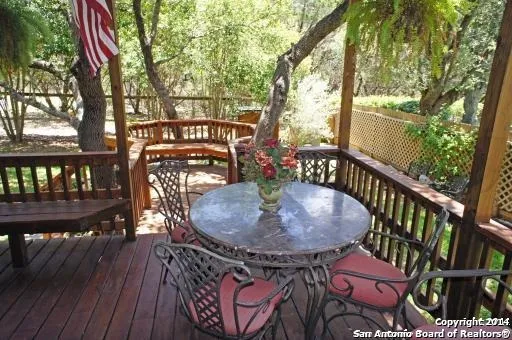 a view of a chairs and table in the balcony