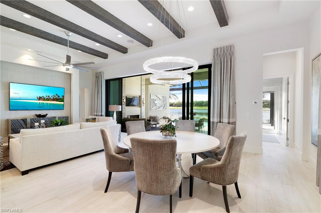 18488 Miromar Lakes Boulevard Miromar Lakes, FL 33913 - Photo 13 of 48 a dining room with furniture and window