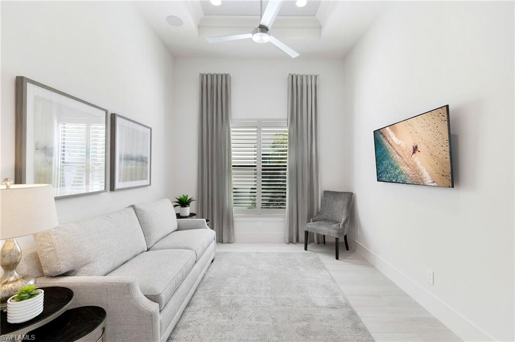 18488 Miromar Lakes Boulevard Miromar Lakes, FL 33913 - Photo 14 of 48 a living room with furniture and a large window