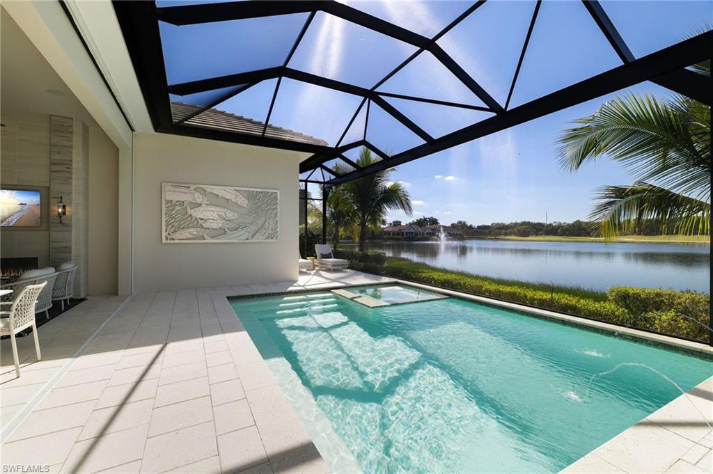 18488 Miromar Lakes Boulevard Miromar Lakes, FL 33913 - Photo 25 of 48 a view of swimming pool with a patio and a yard