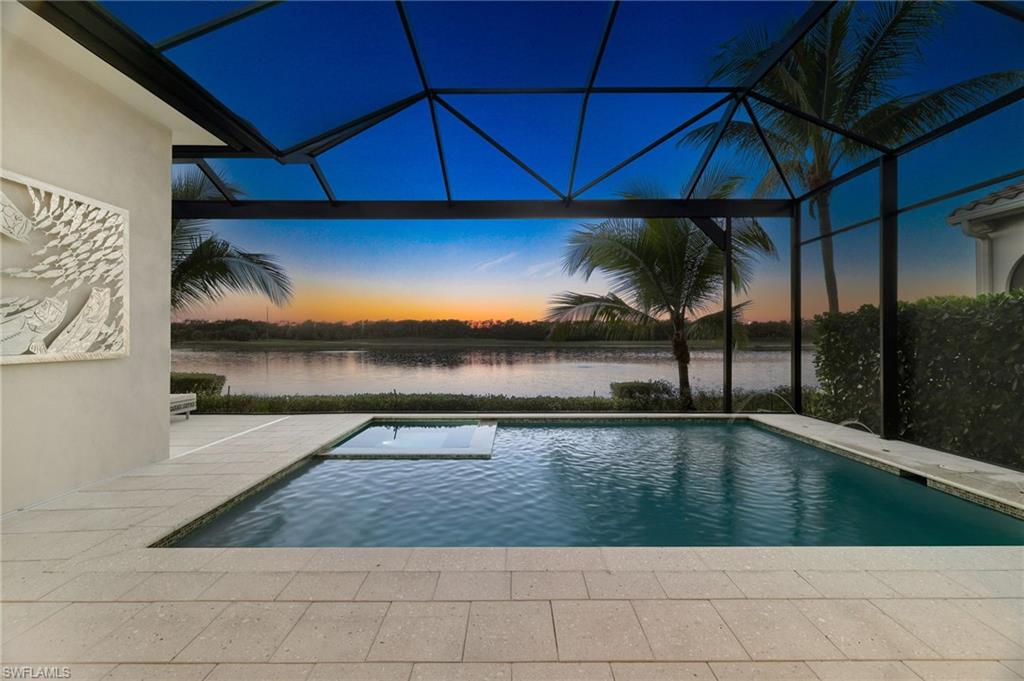 18488 Miromar Lakes Boulevard Miromar Lakes, FL 33913 - Photo 29 of 48 a view of a living room and a floor to ceiling window