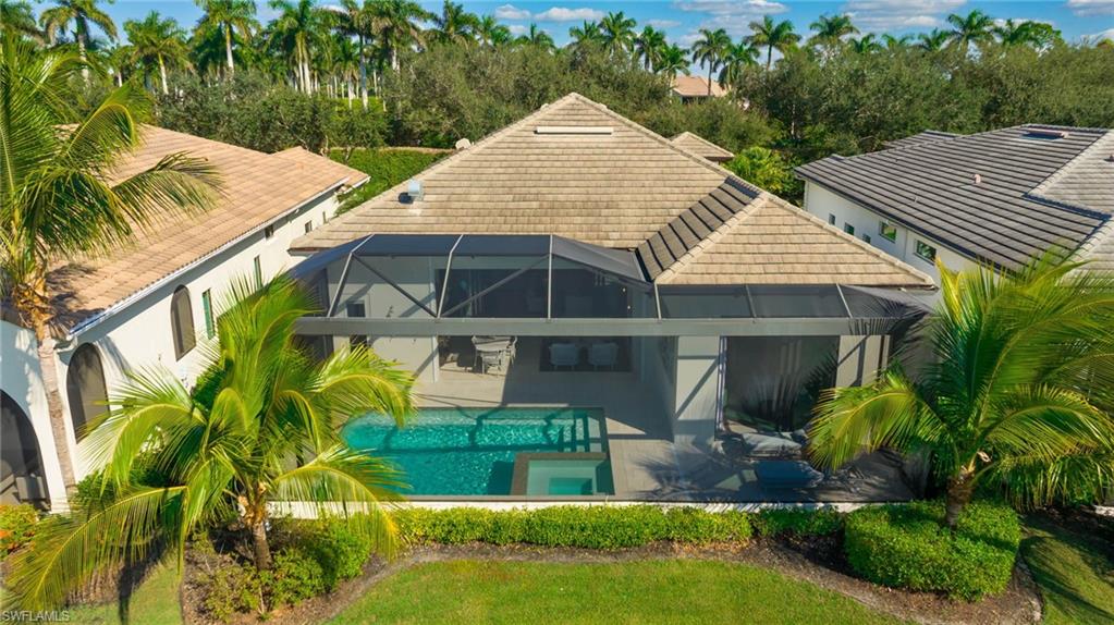 18488 Miromar Lakes Boulevard Miromar Lakes, FL 33913 - Photo 32 of 48 an aerial view of a house