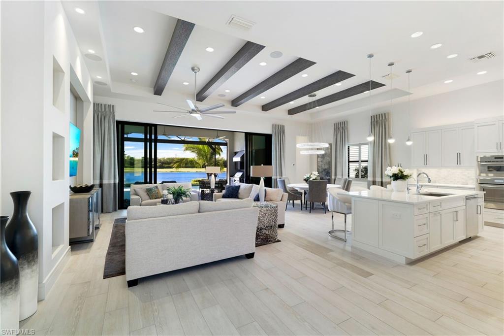 18488 Miromar Lakes Boulevard Miromar Lakes, FL 33913 - Photo 5 of 48 a living room with furniture and a large window