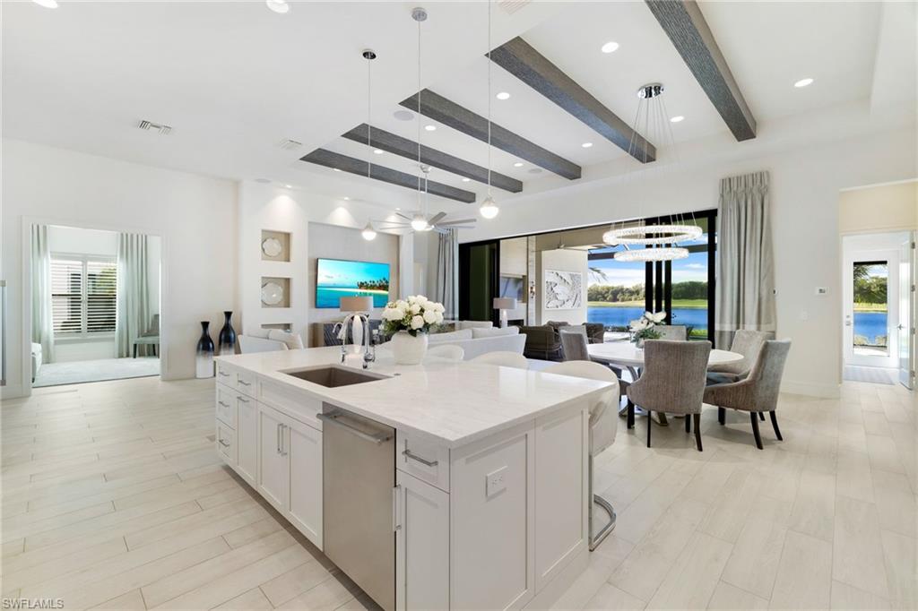 18488 Miromar Lakes Boulevard Miromar Lakes, FL 33913 - Photo 10 of 48 a large white kitchen with a large window