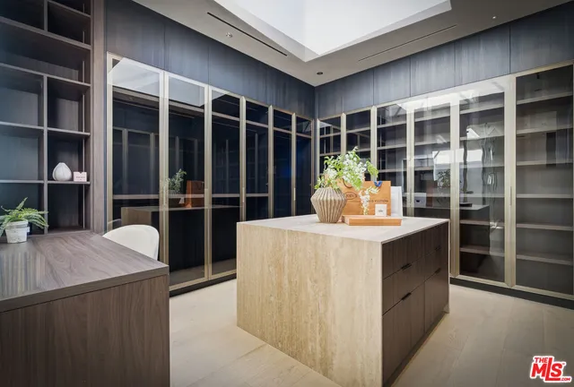 a room with furniture and a potted plant