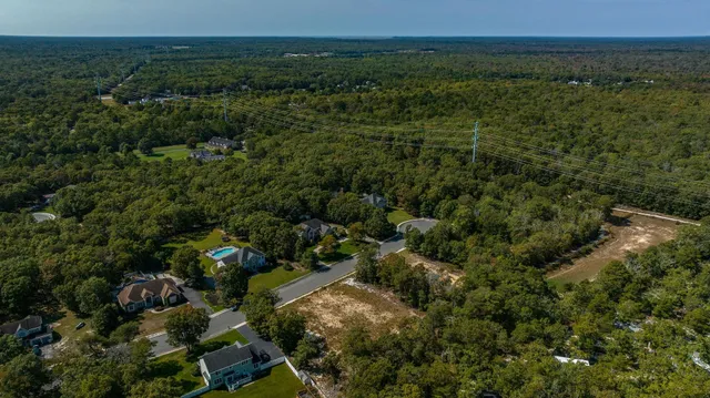 an aerial view of house with yard