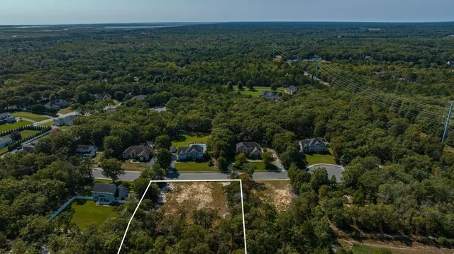 an aerial view of a house with lots of trees