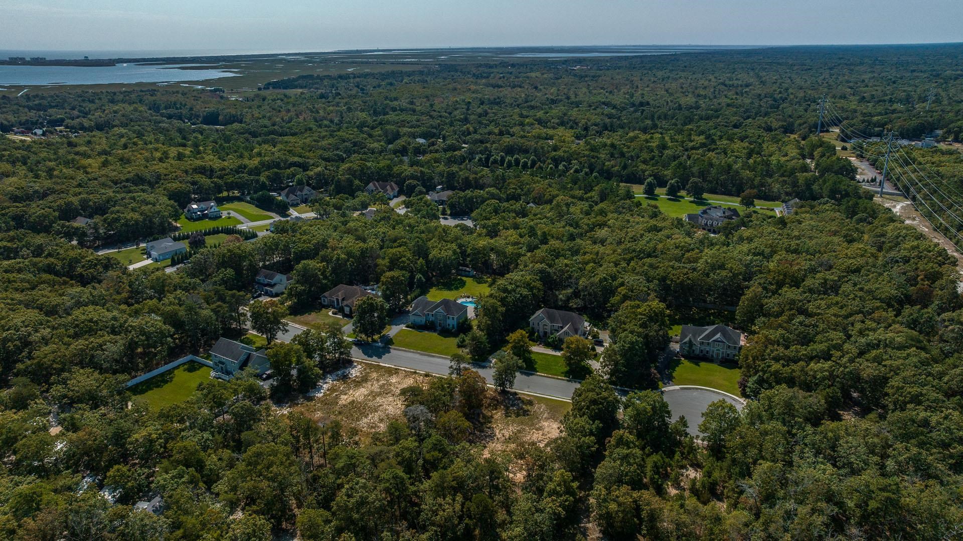 15 Clayton Ocean View, NJ 08230 - Photo 23 of 29 an aerial view of residential house with outdoor space and trees all around