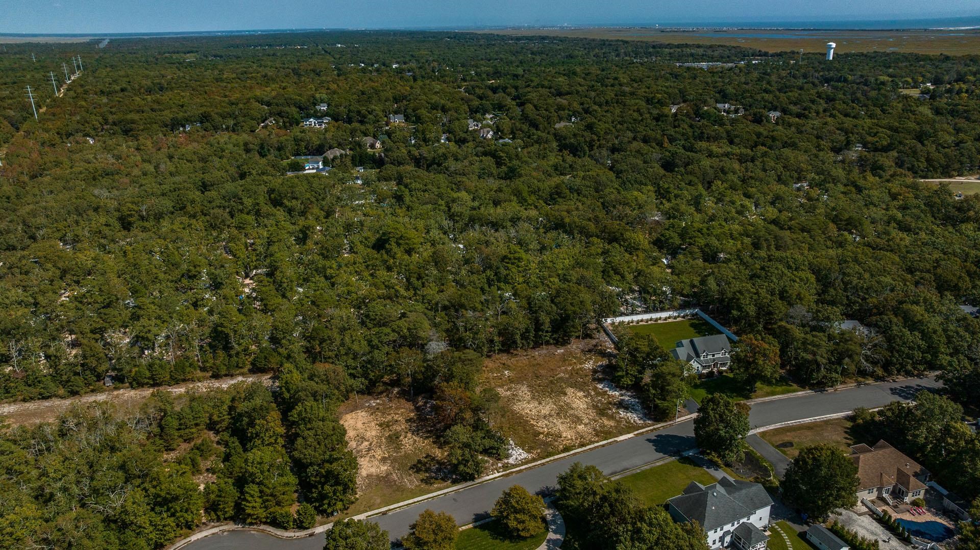 15 Clayton Ocean View, NJ 08230 - Photo 5 of 29 an aerial view of a house with a yard