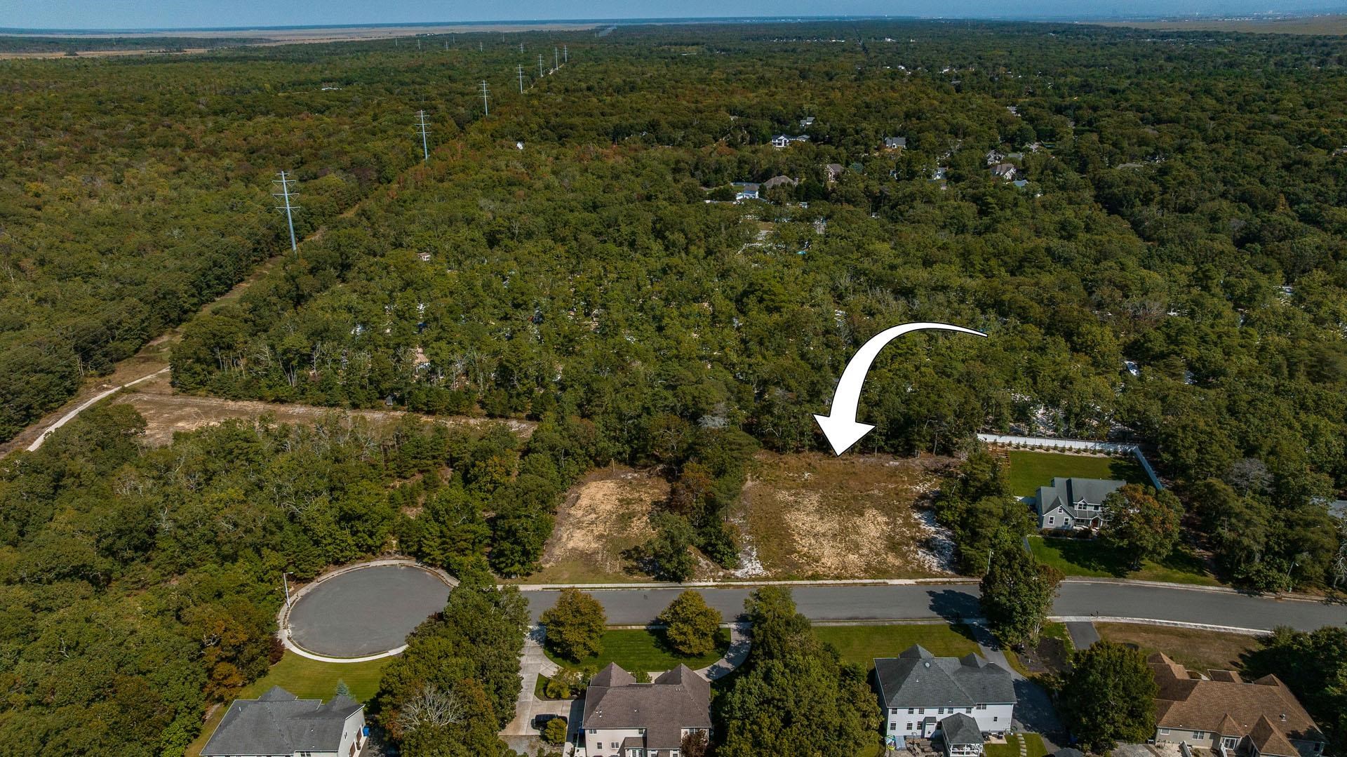 15 Clayton Ocean View, NJ 08230 - Photo 8 of 29 a aerial view of a house with a yard and lake view