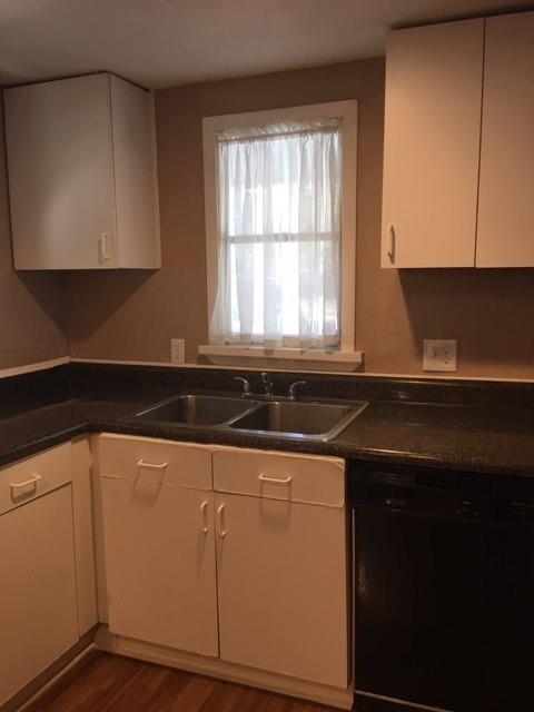 4410 Bonham Street Dallas, TX 75229 - Photo 7 of 14 a kitchen with granite countertop a sink and a stove