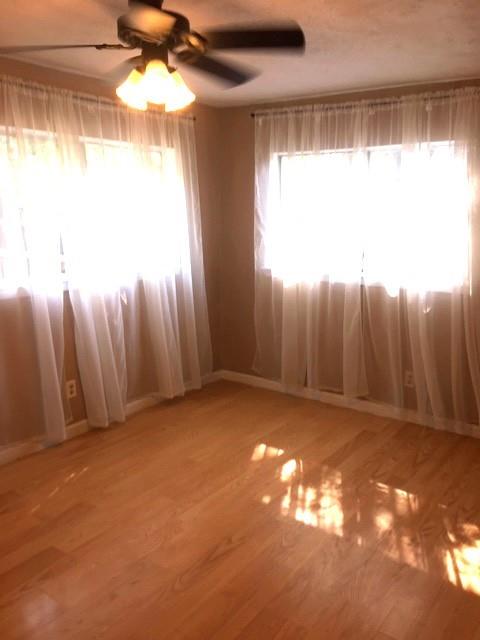 4410 Bonham Street Dallas, TX 75229 - Photo 8 of 14 a view of a room with a window and a ceiling fan