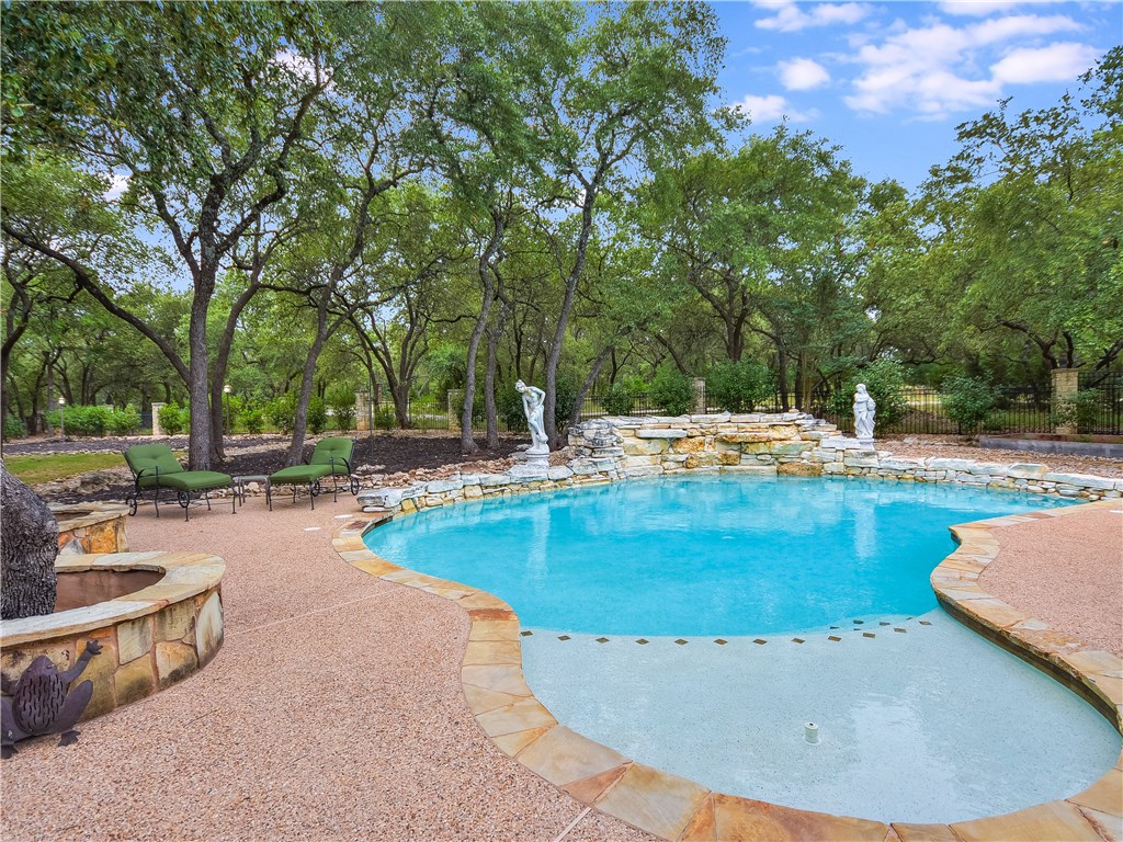 a view of a swimming pool with a patio