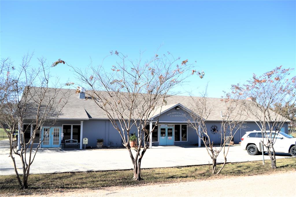 Lot 252-253 Choctaw Quitman, TX 75783 - Photo 15 of 20 a front view of a house with a tree