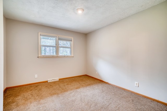 1331 West Maple Road New Lenox, IL 60451 - Photo 9 of 17 an empty room with windows