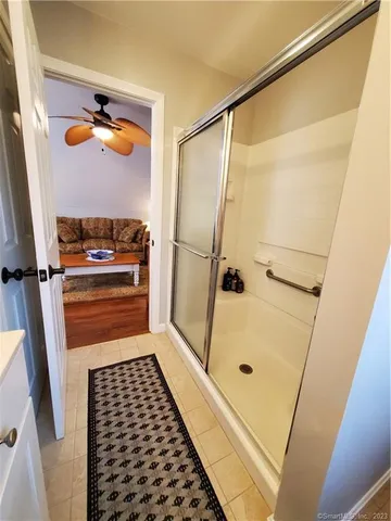 a bathroom with a tub and a shower