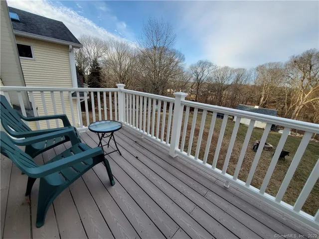 a view of a chairs setting on the roof deck